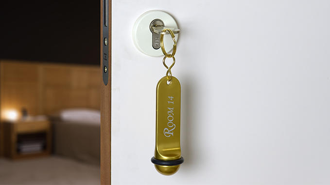 Hotel key fob in gold-coloured aluminium
