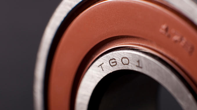 Fine and precise marking on metal ball bearings